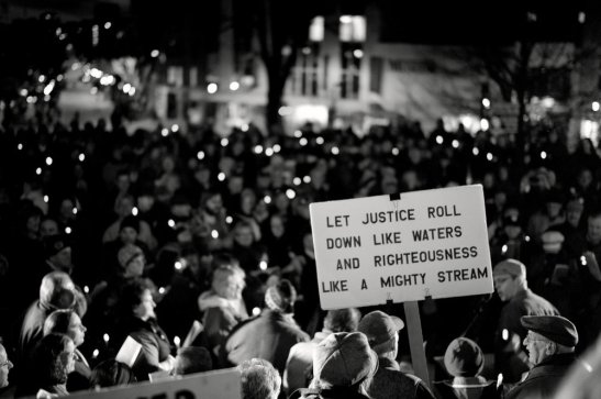 Amos 5 placard in crowd large